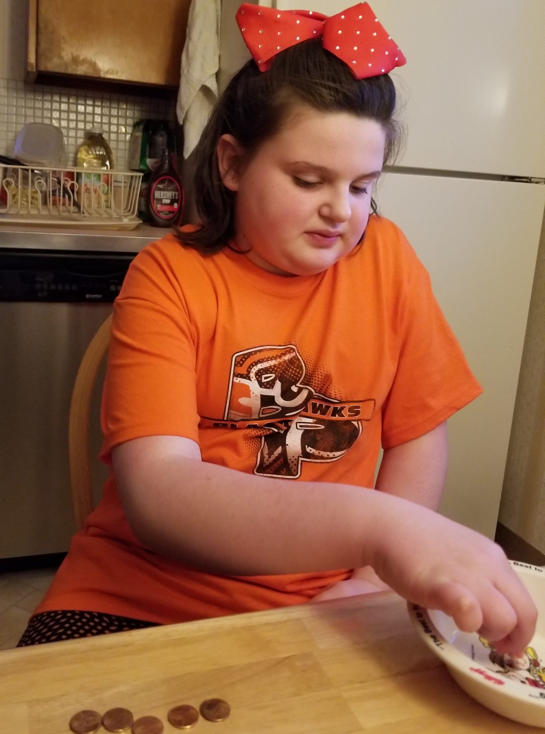 Girl sorting pennies